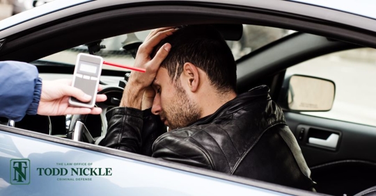 man doing a breath test